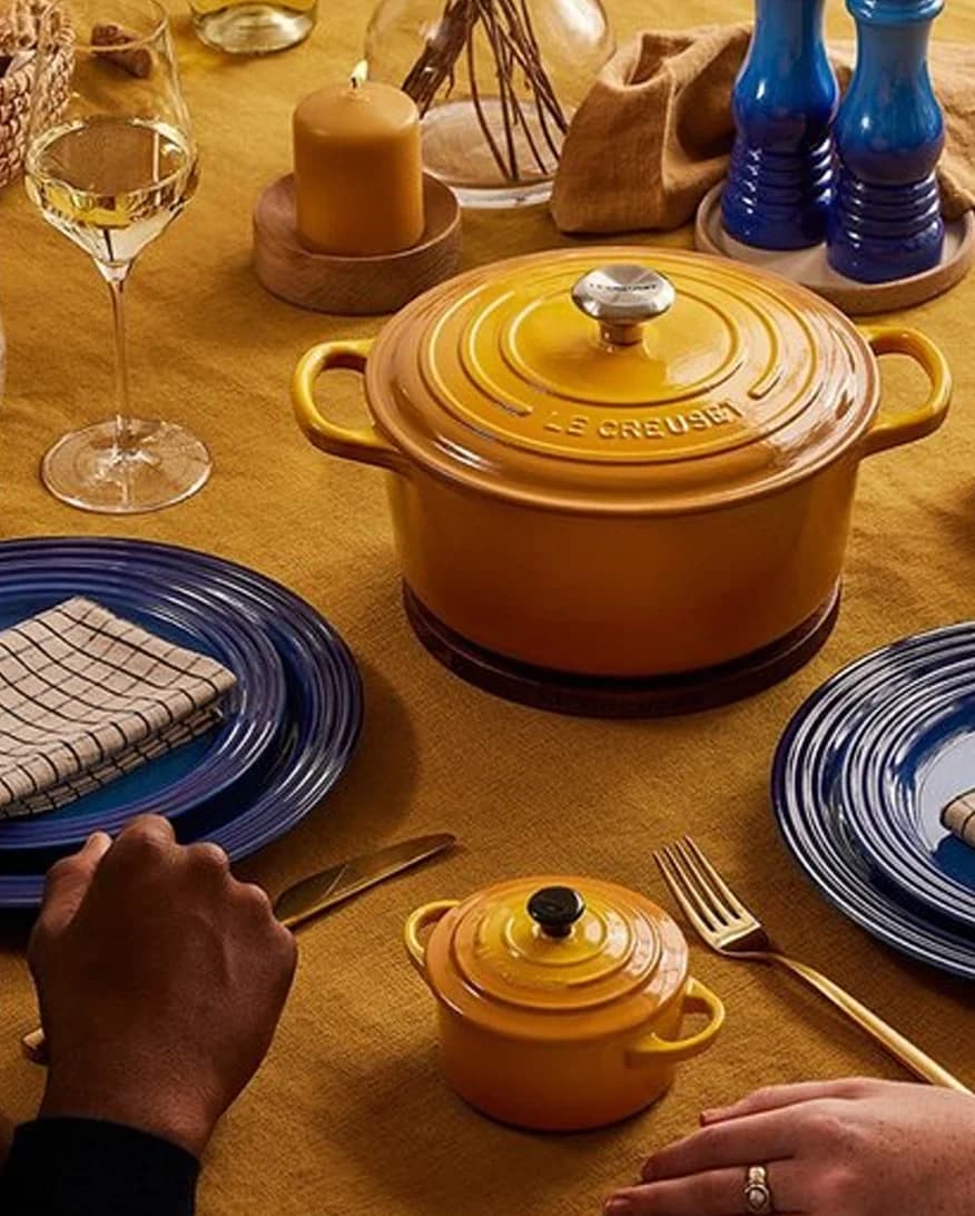 A couple enjoys dinner from their nectar Le Creuset round casseroles 