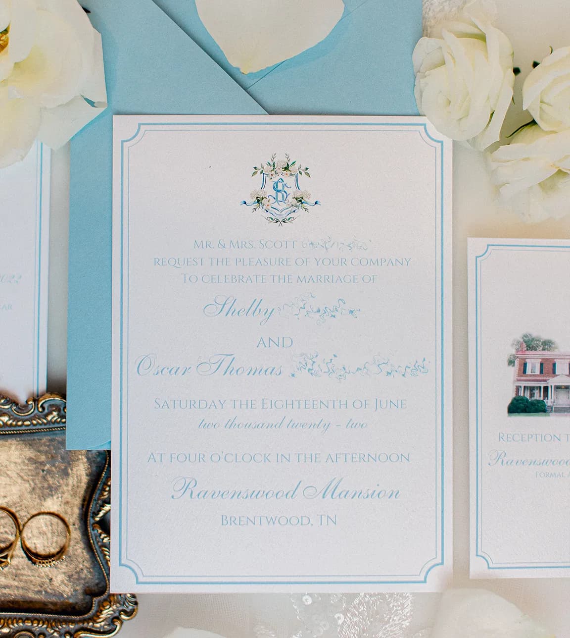 Pale blue envelope and elegant wedding invite with traditional formal wording.