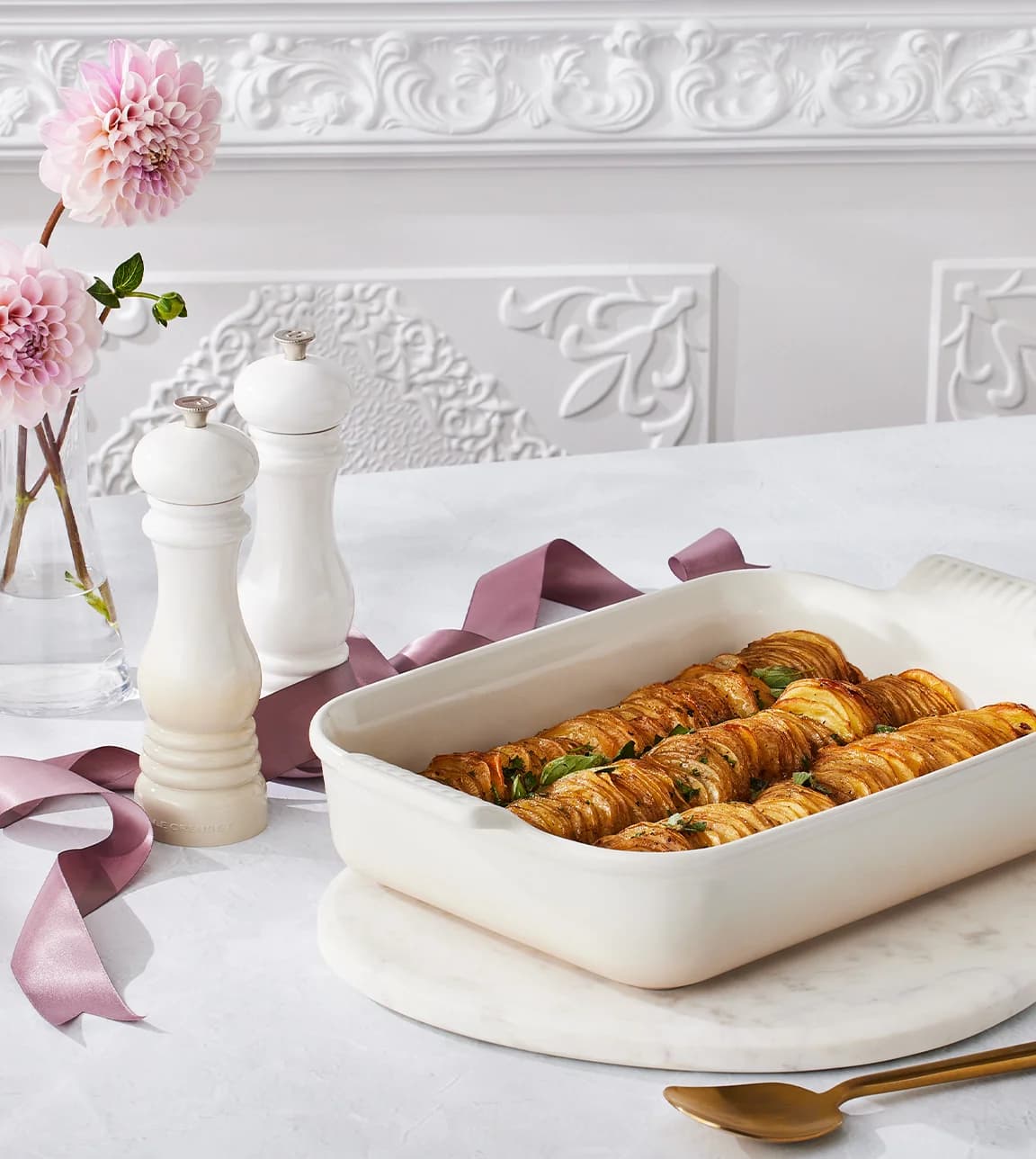 Le Creuset recipe for October featuring crispy buttery potato bake in Le Creuset rectangular dish