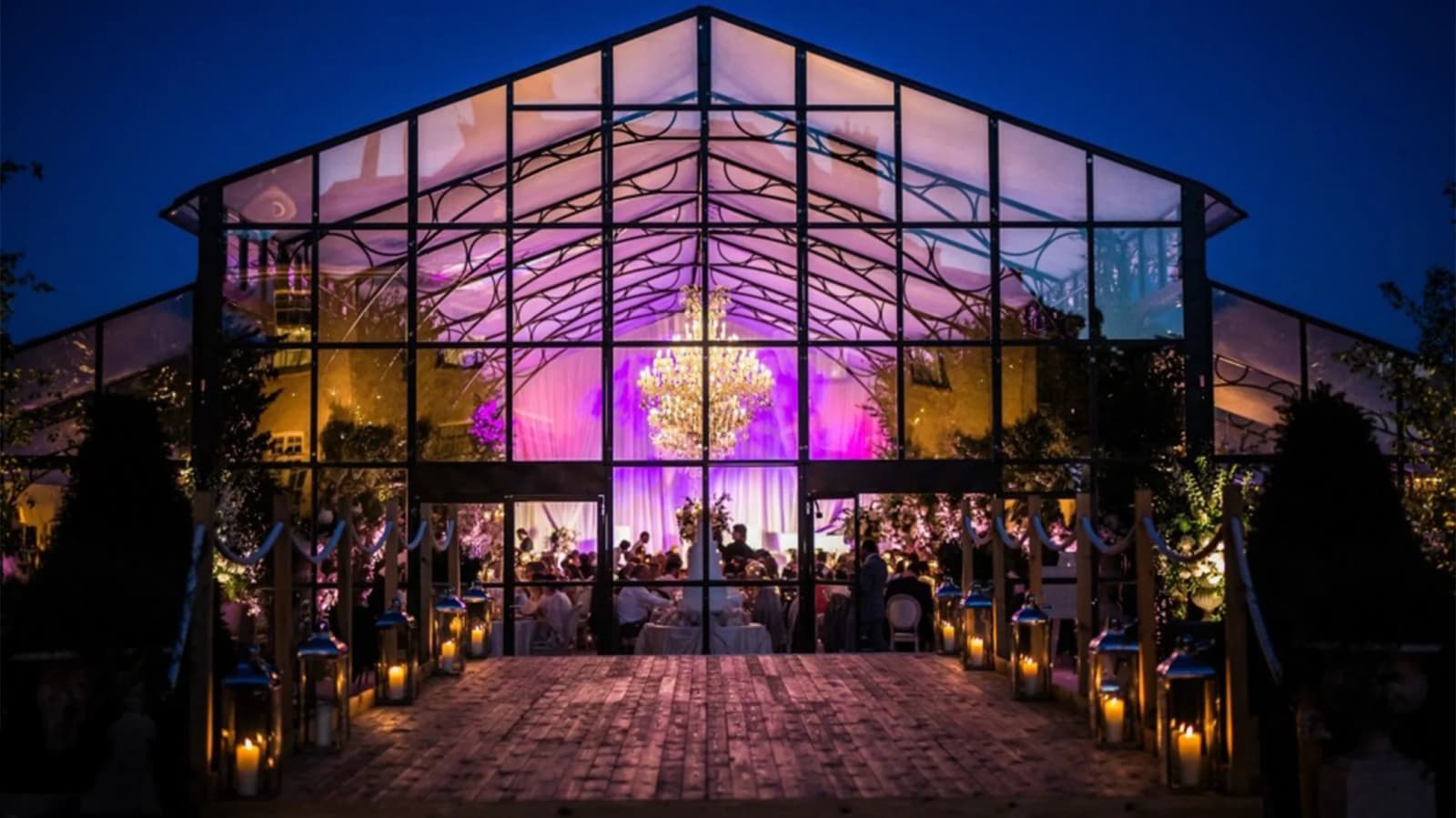 Wedding celebrations at glass pavilion marquee