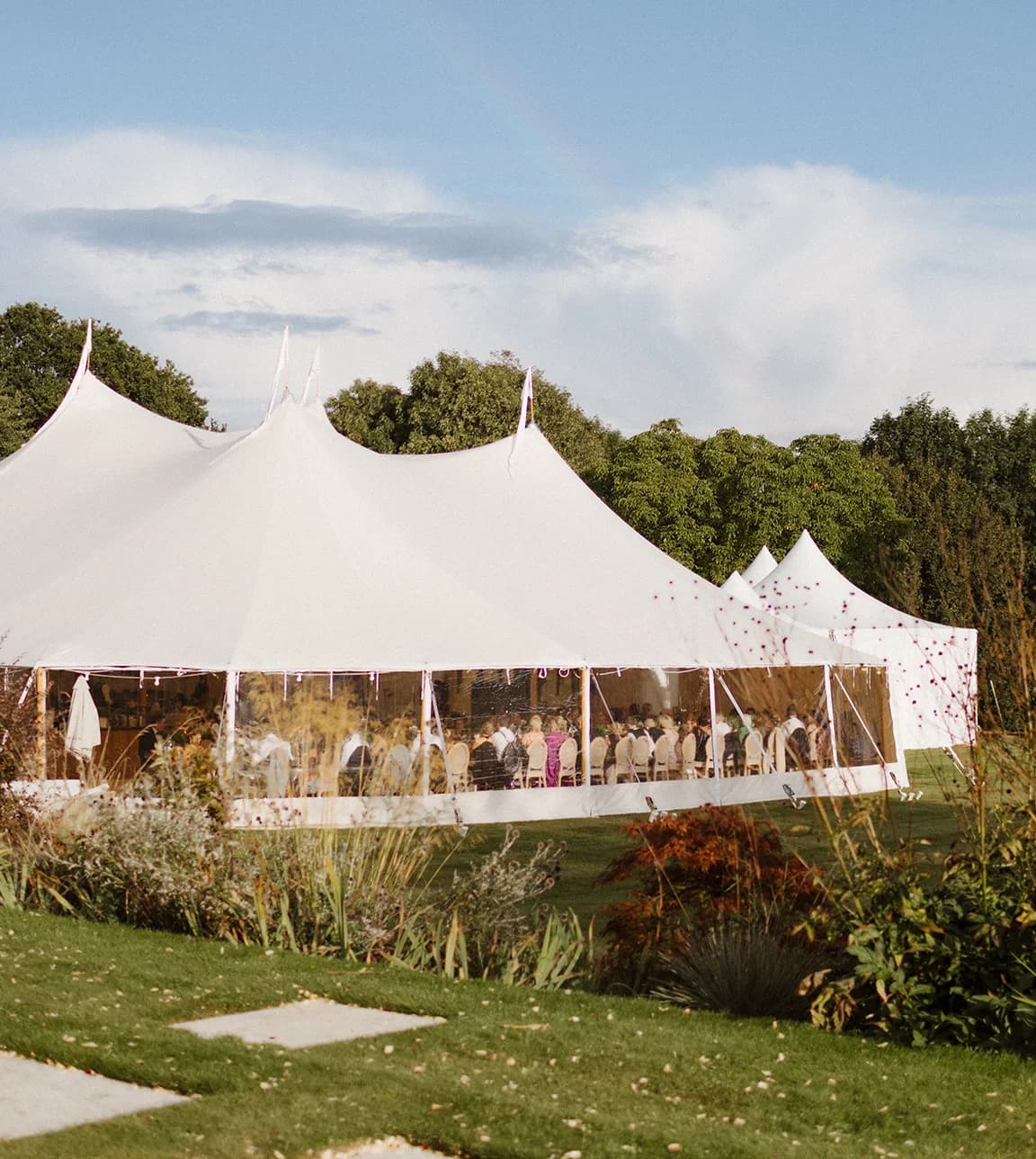 A wedding marquee in a lush green garden