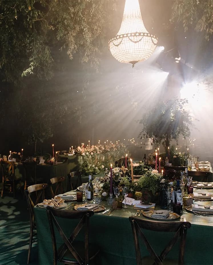 Secret Garden themed table décor with candles, inside a wedding marquee at Euridge Manor