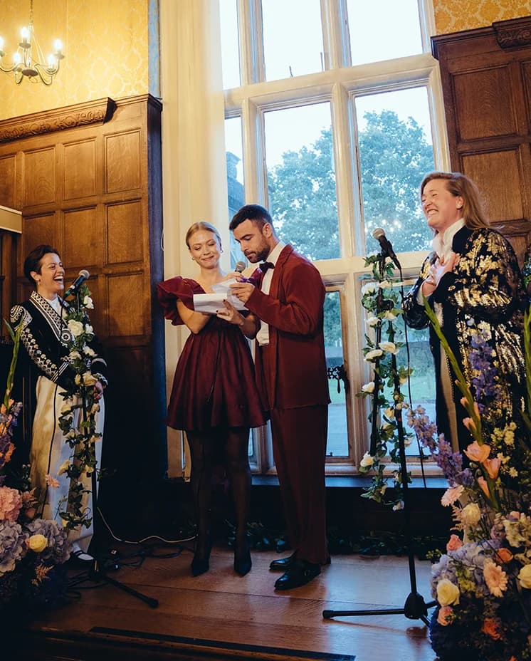 Friends give speech during Emma & Claudia's wedding in Kingswood house