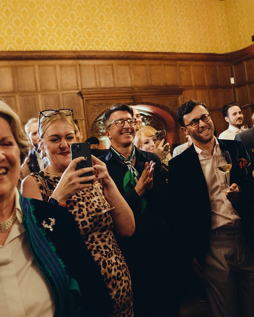 Wedding guests drink wine