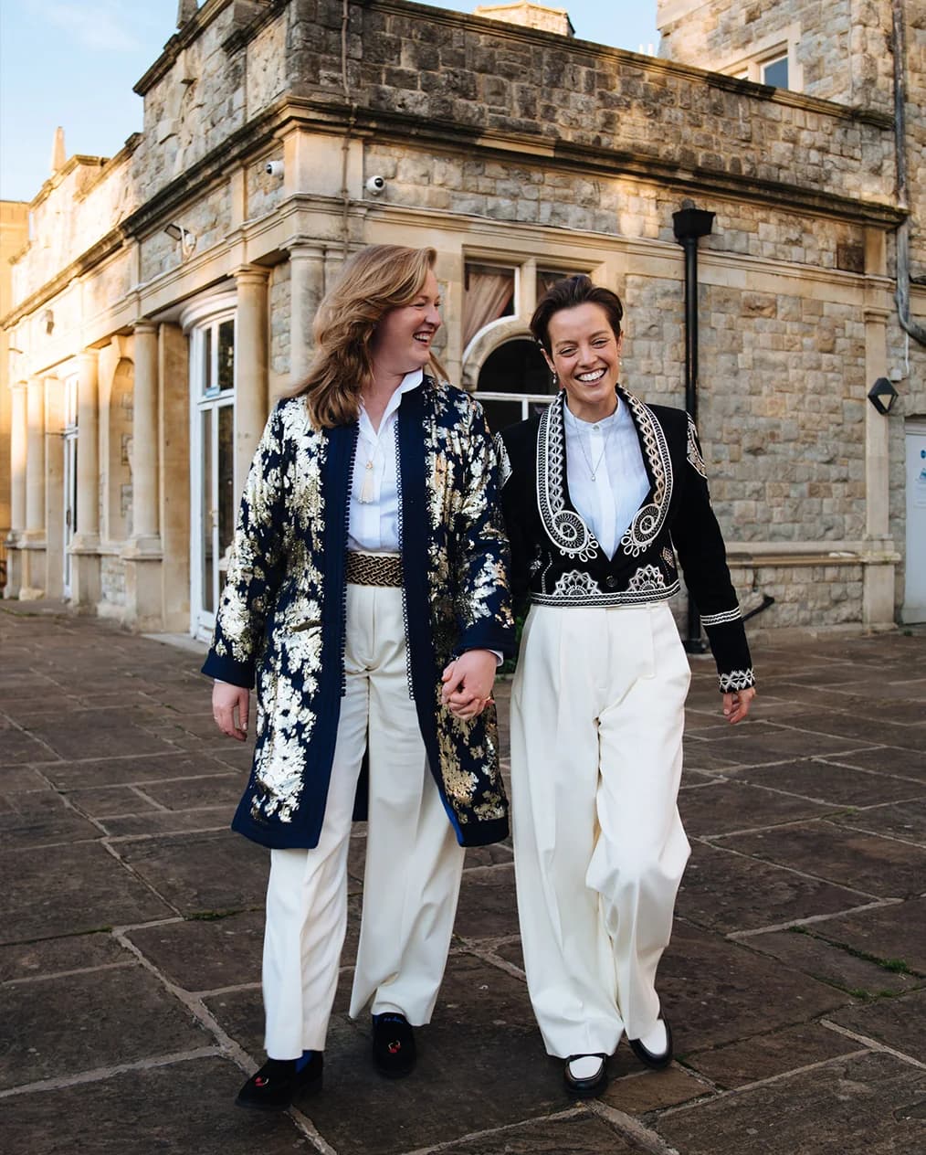 Brides walk outside Kingswood House