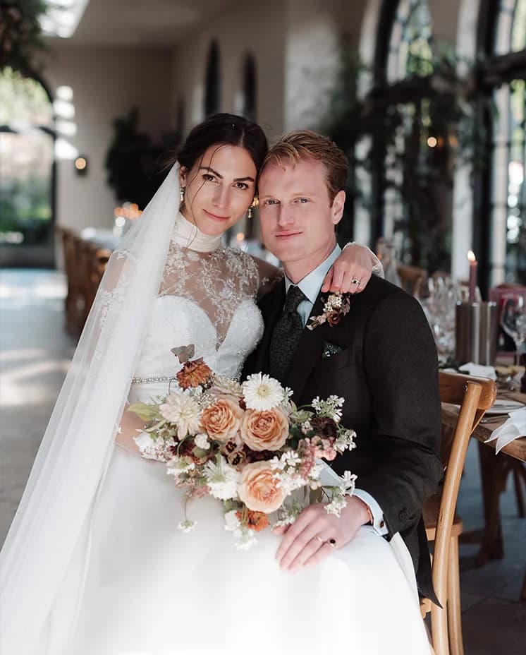Bride and groom sit inside the Fig House