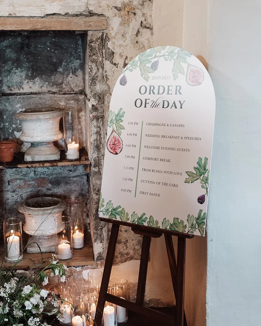 Themed Order of The Day board with fig tree illustrations.