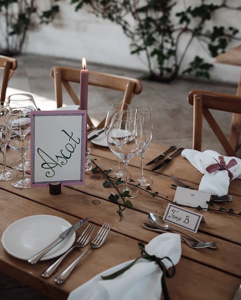 Pink and green handwritten wedding table stationery.