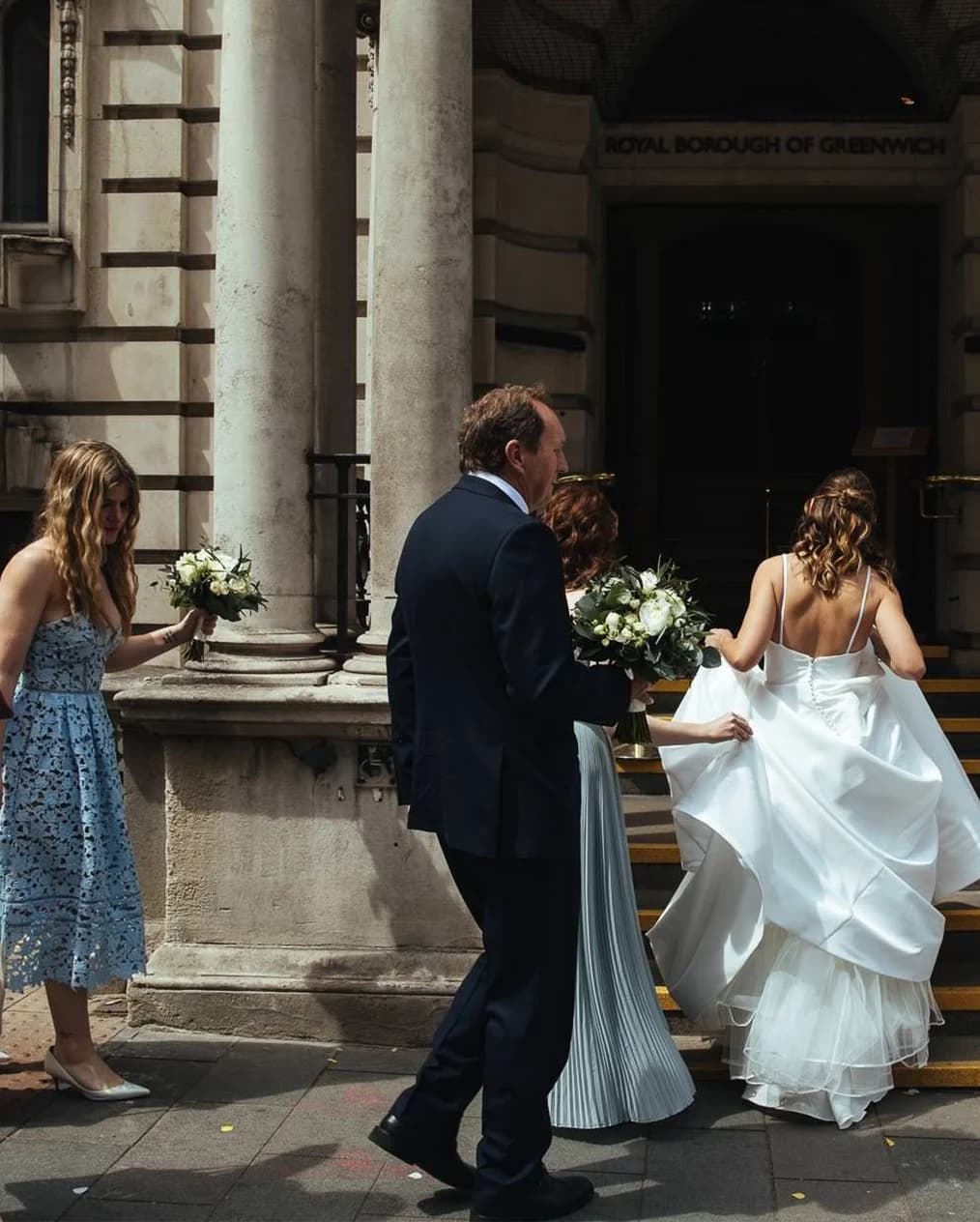 Bride and her party enters Woolwich Town Hall for her wedding ceremony