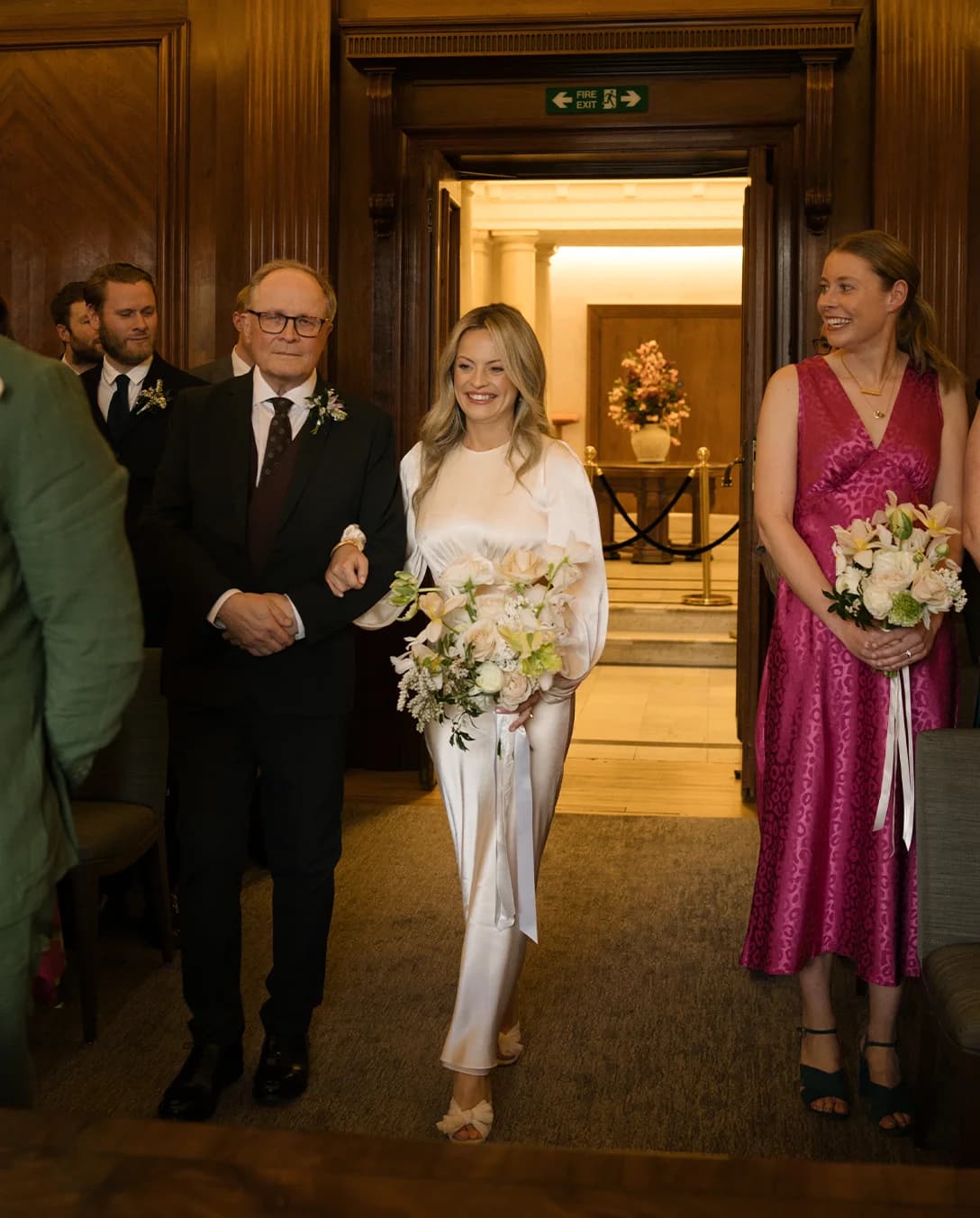 Bride and her father walk down the aisle at Old Marylebone Town Hall