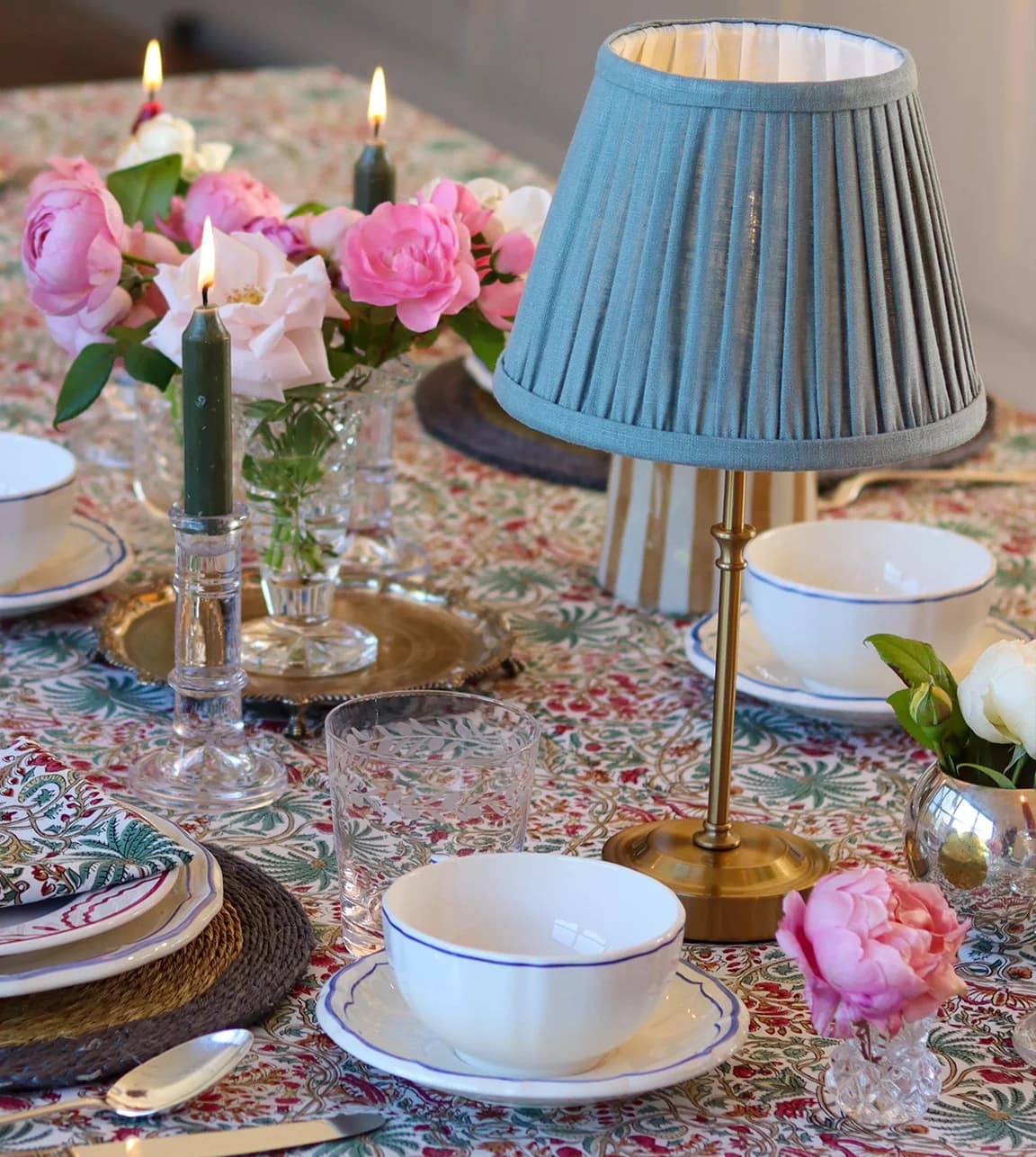 A Christmas table centerpiece, rechargeable lamp, is placed on beautifully decorated table