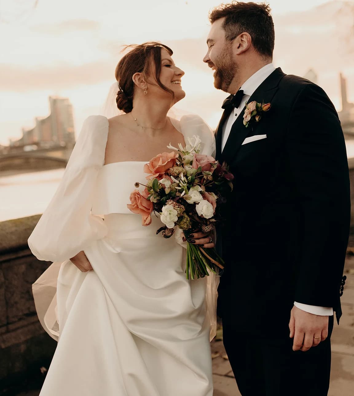 Bride and groom look each other during their winter wedding in London