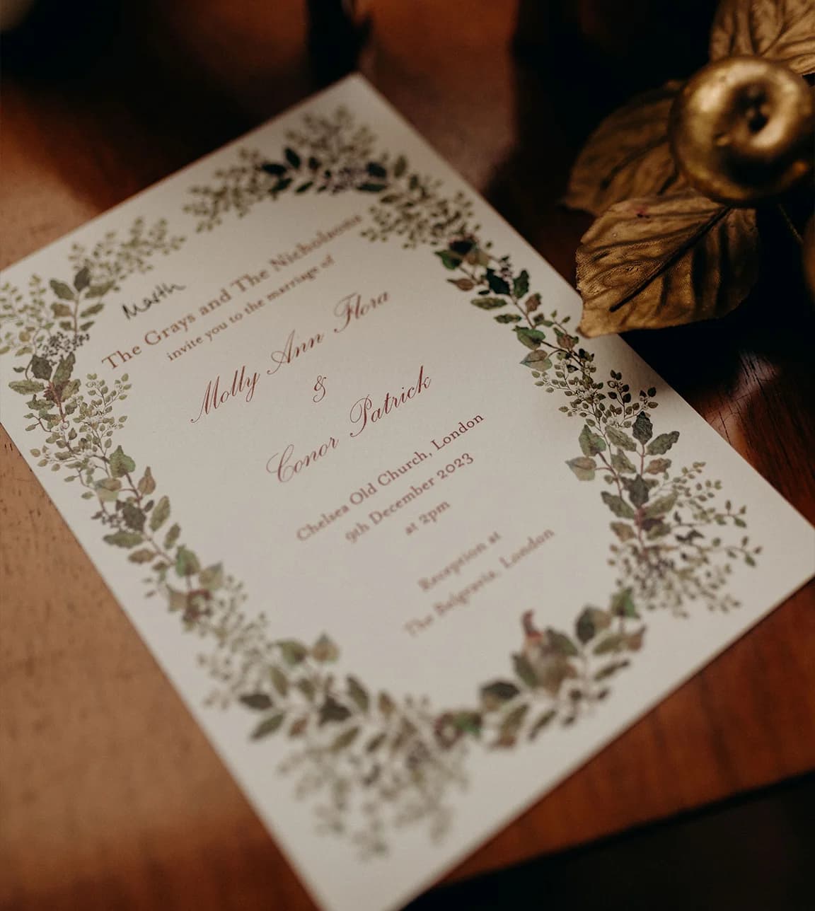 Wedding invitation with floral ornaments around the borders