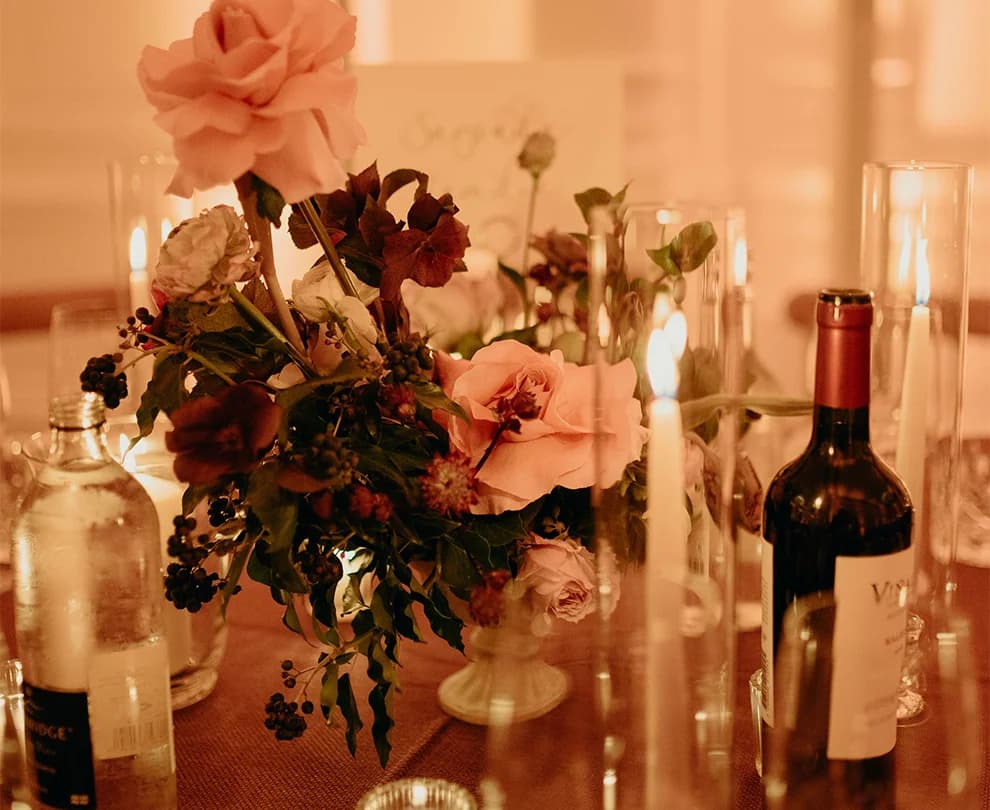 Winter wedding floral arrangements on table decorated with candles