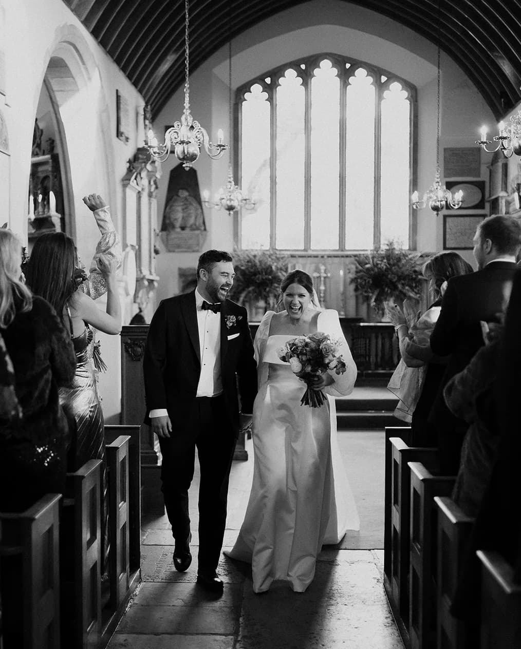 Bride and groom walk down the aisle after their church wedding ceremony.
