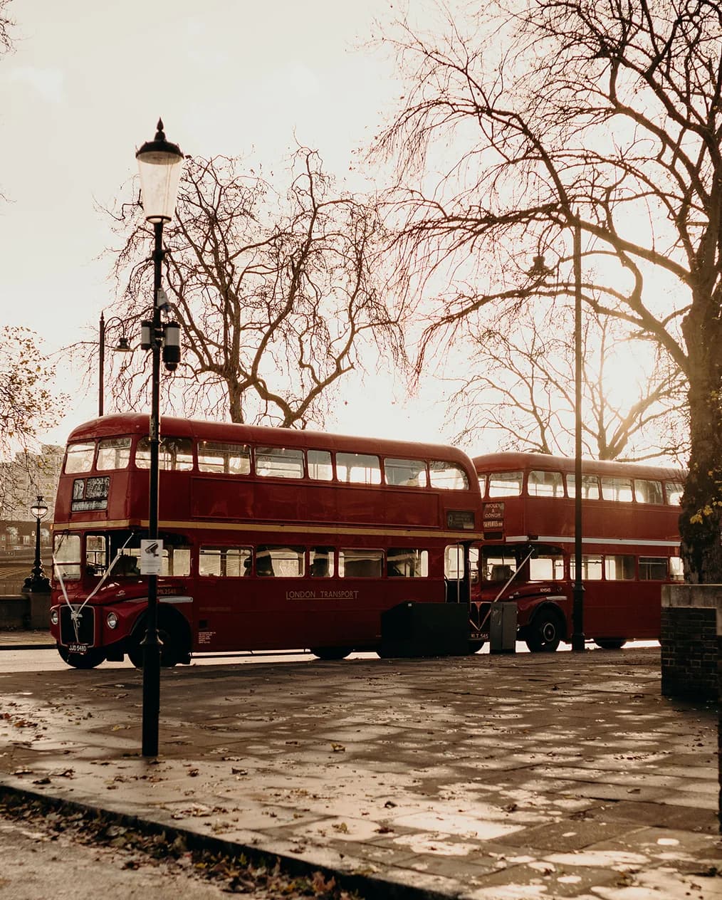 Routemaster double decker buses wait for the wedding party outside the venue
