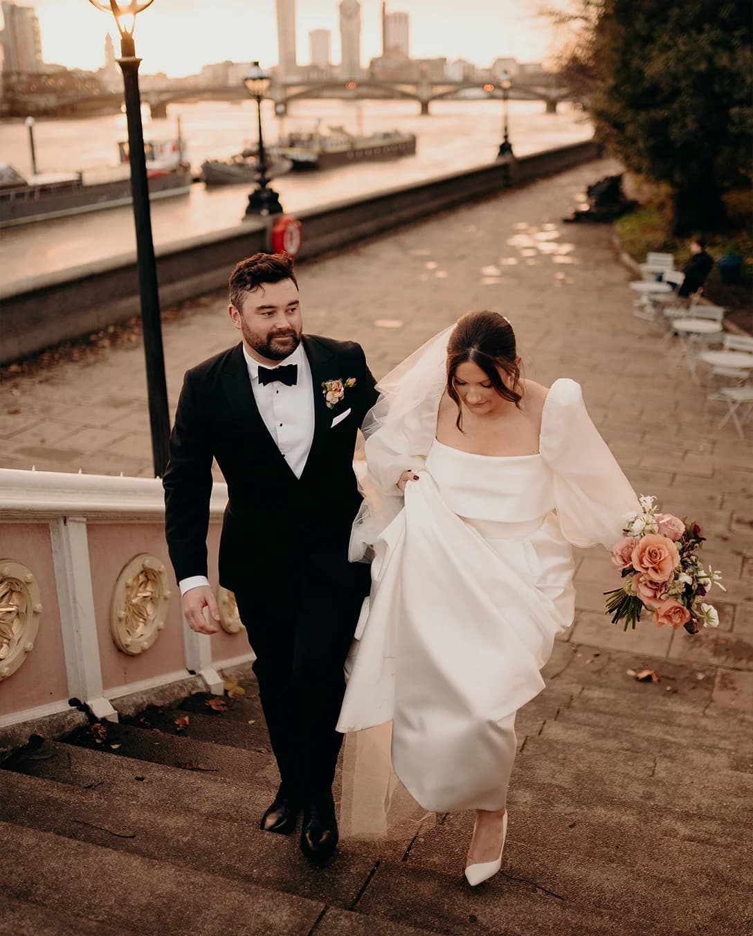 Bride and groom walking up stairs