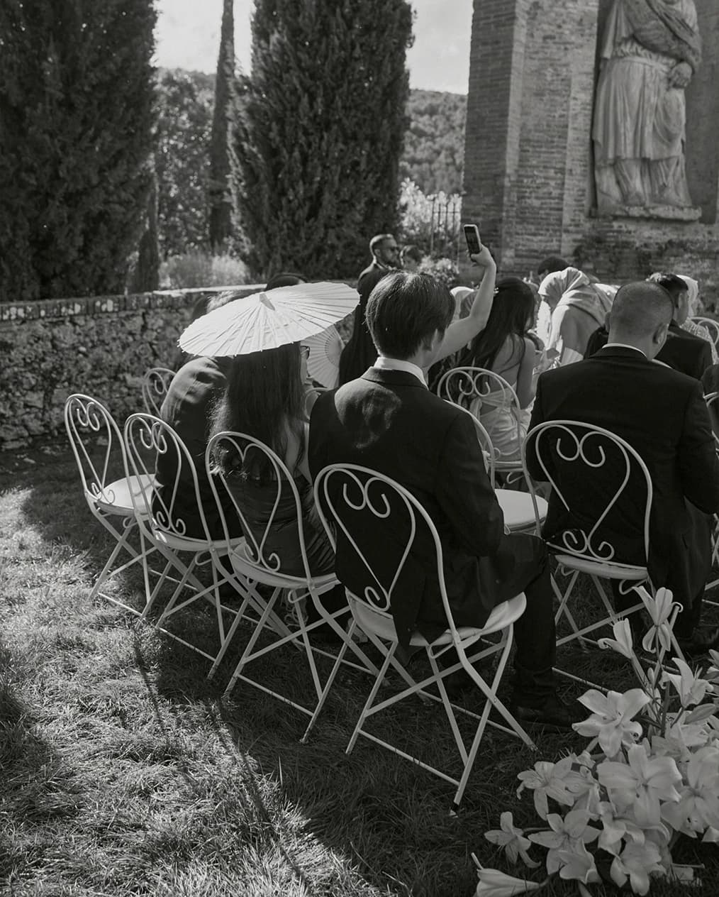 Wedding ceremony scene at Villa Centinale with guests seated on elegant chairs