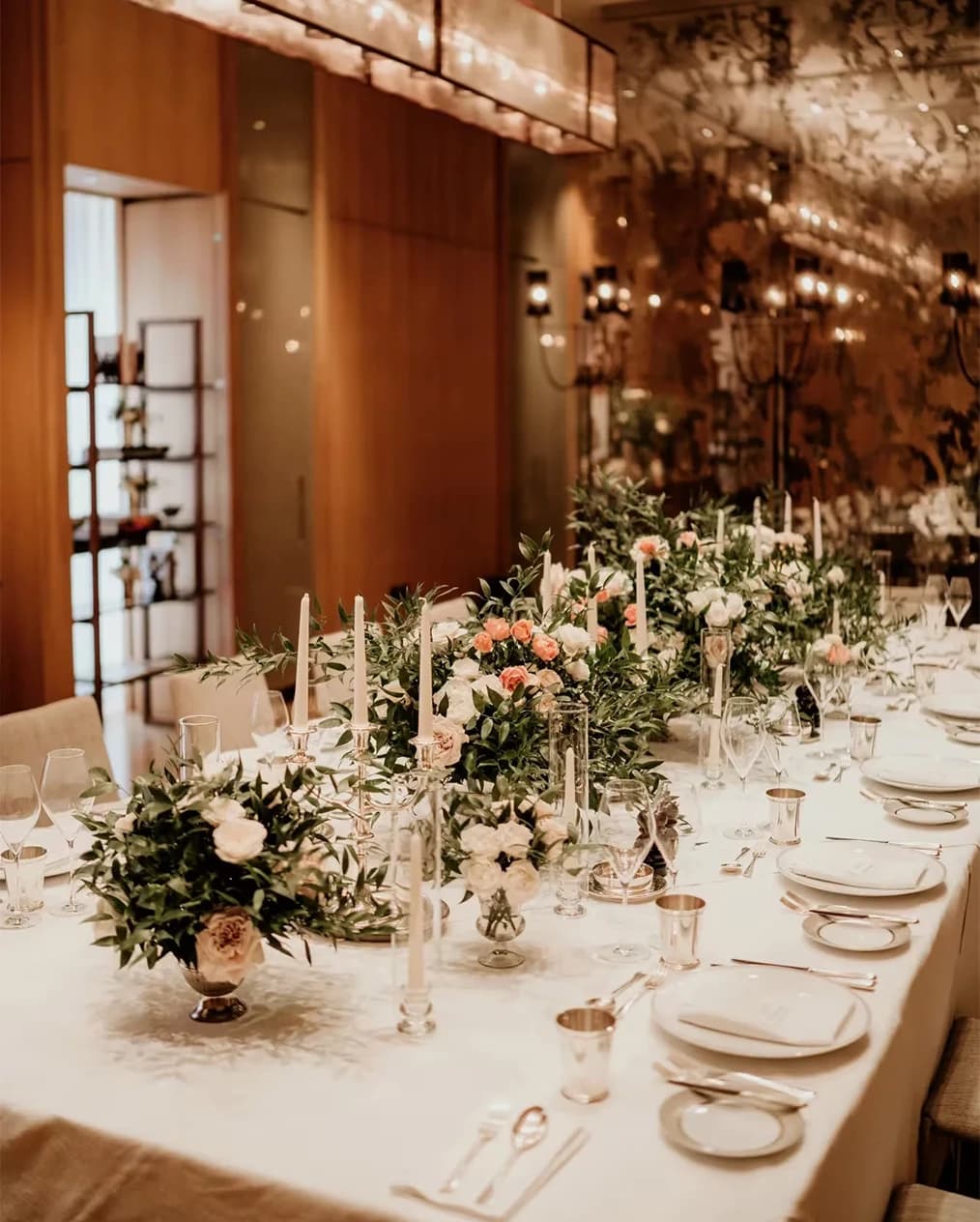 Elegant wedding reception table at Rosewood London with candlelight, floral centrepieces, and luxury place settings
