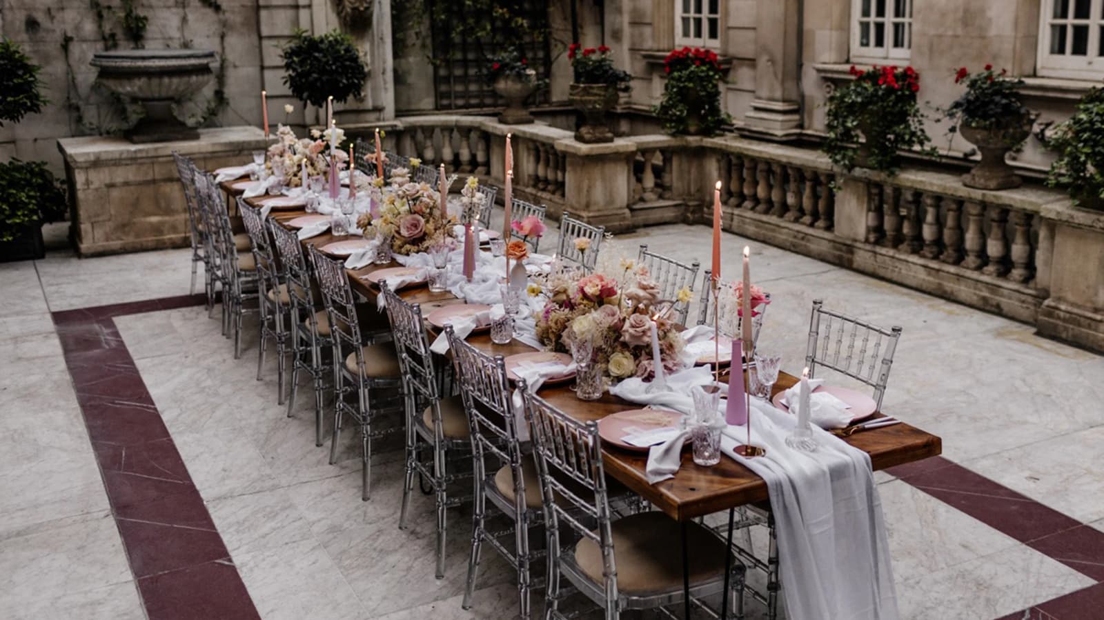 Dartmouth House London wedding venue courtyard with al fresco dining setup, long table, flowers, and candlelight