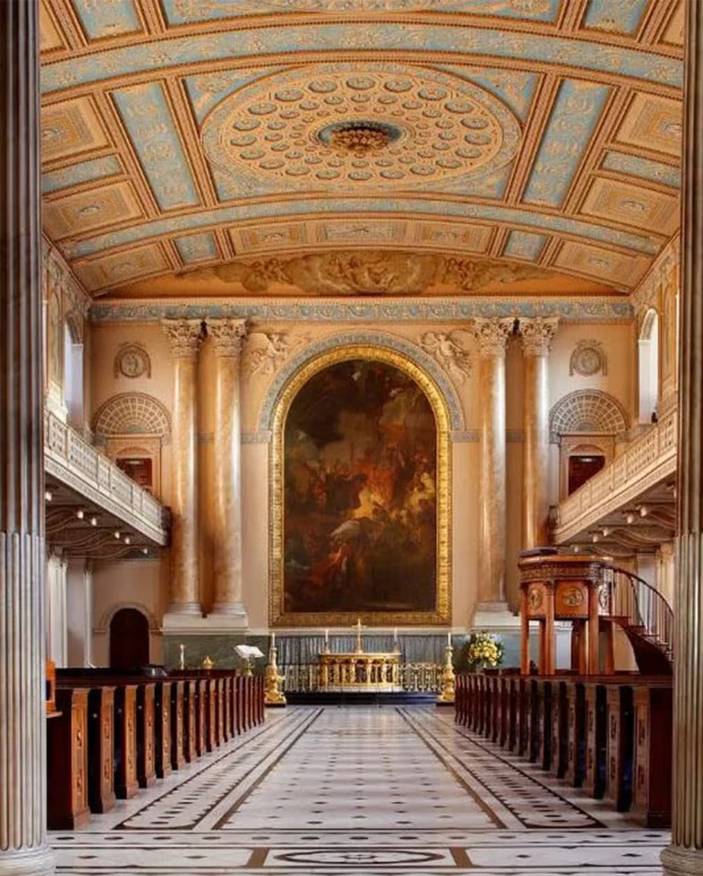 Wedding ceremony venue inside Old Royal Naval College London chapel with grand columns, ornate ceiling, and aisle seating
