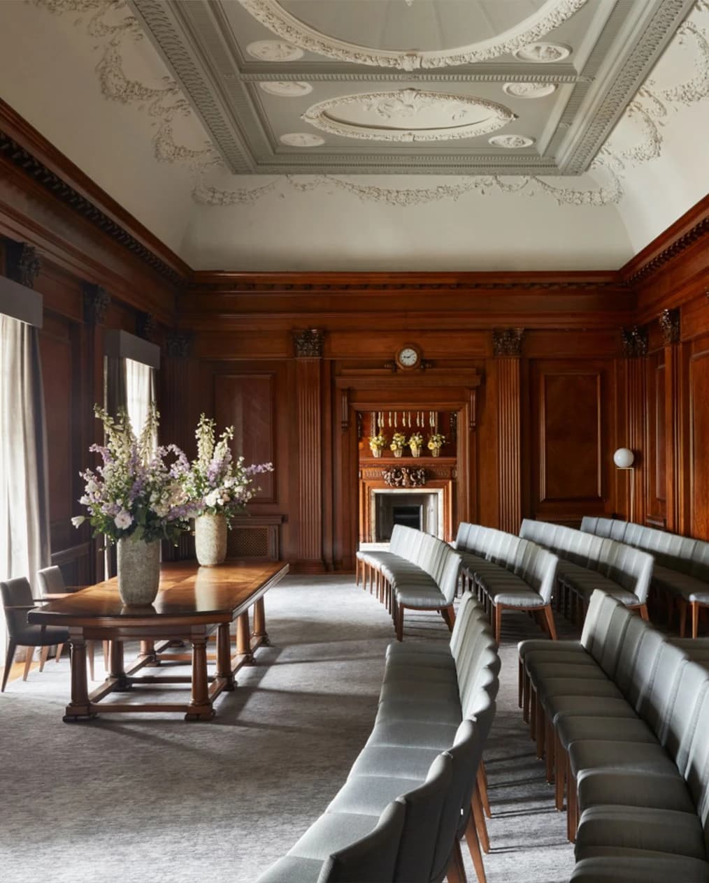 Wedding ceremony room at Old Marylebone Town Hall London with wood-panelled walls, elegant seating, and classic interior