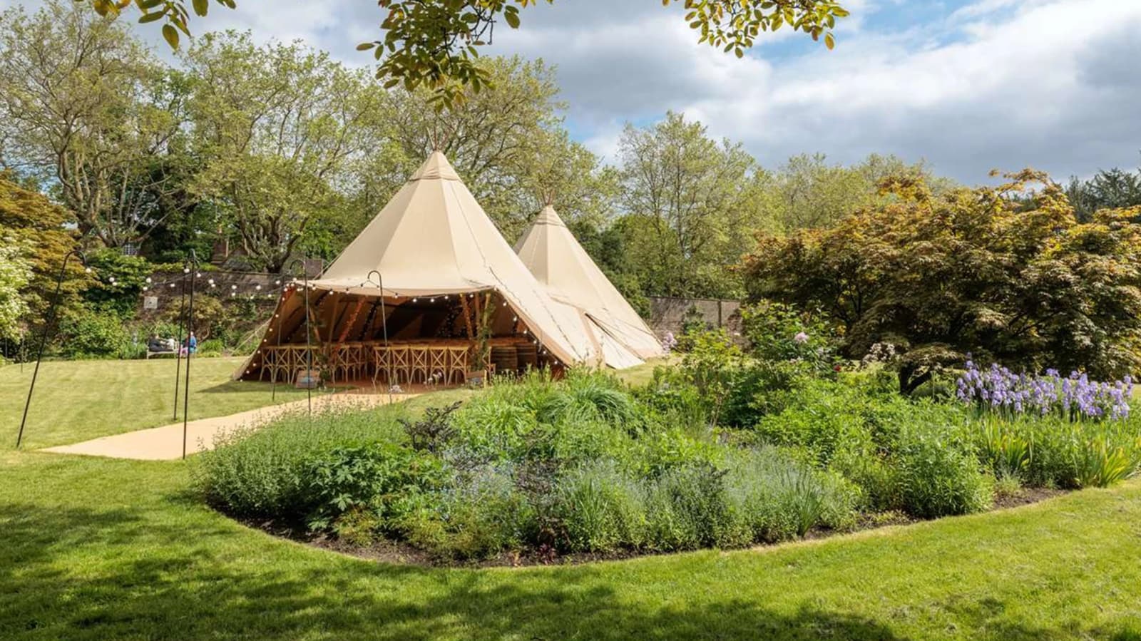 Wedding reception at Kenwood House London garden with marquee tents and landscaped greenery