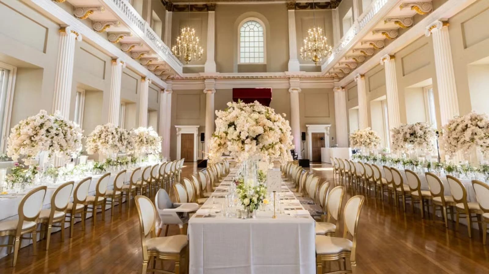 Elegant wedding reception at Banqueting House featuring tall floral centrepieces, chandeliers, and a magnificent historic setting