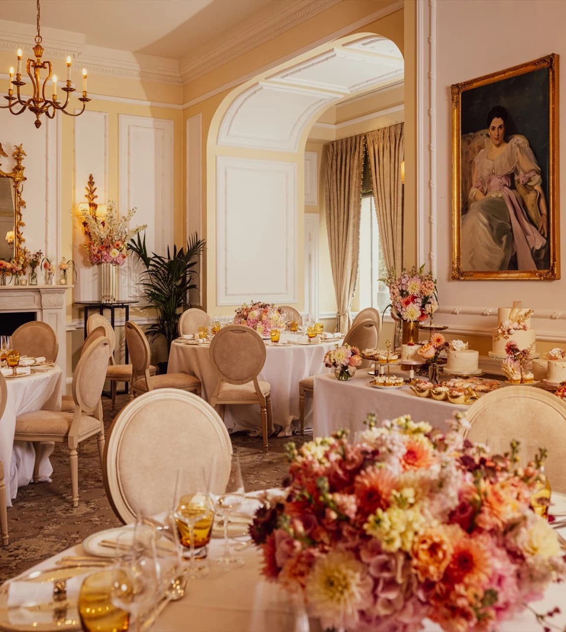 Wedding reception at one of the best London wedding venues, The Savoy, with elegant floral tables, pastel décor, and classic luxury interiors