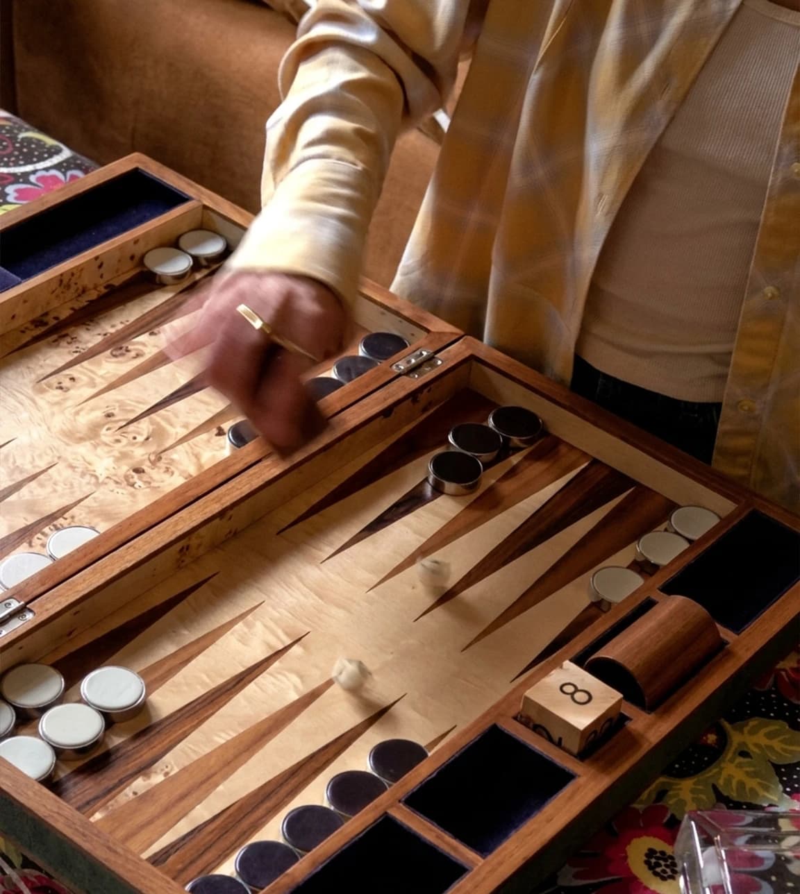 Lucy Williams is at home, playing with Forwood Design backgammon board
