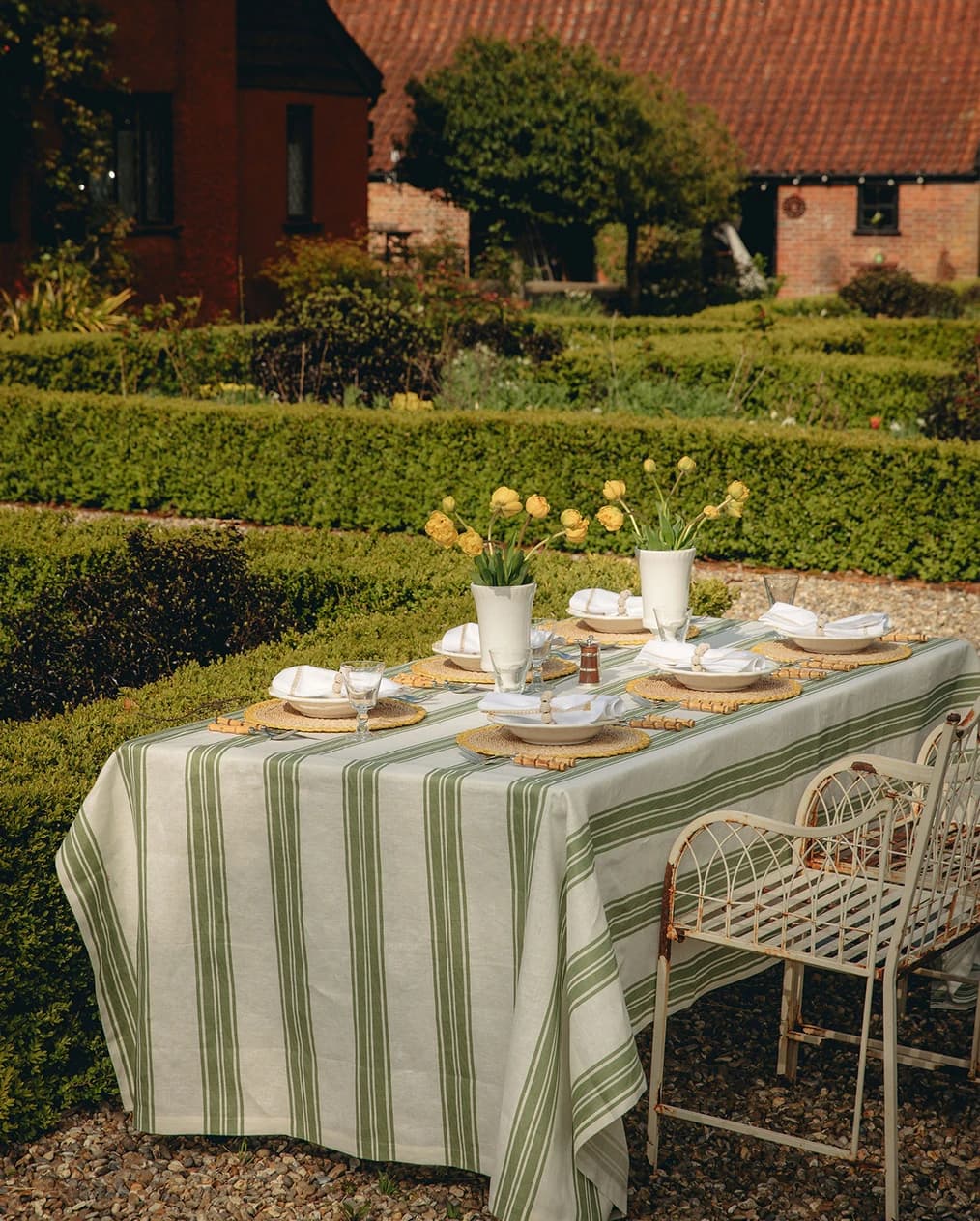 A beautifully set outdoor tablescape placed in the garden